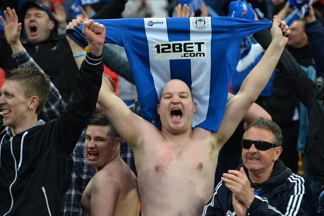 Wigan Athletic supporters celebrate their victory after the FA Cup semi-final