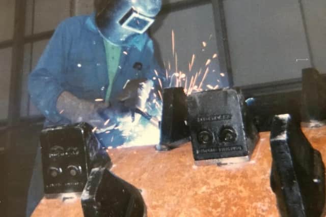 Granville Thomas Dunn at work welding.