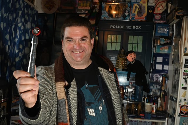 Doctor Who fan Brian Mattocks with his sonic screwdriver, one of many thousands of pieces of memorabilia.