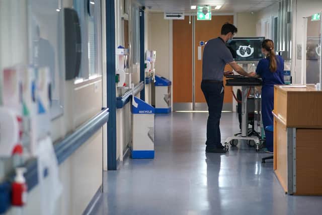 Tens of thousands of patients were waiting for routine treatment at Wigan's hospitals in May