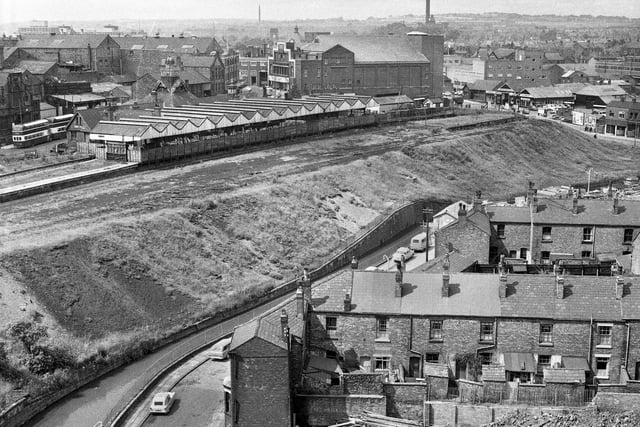 A view taken from the newly built Woodcock House flats towards the closed Central Station with the Ritz cinema behind. On the right is Crompton Street and in the foreground is Derby Terrace with rows of houses in Bold Street and Low Street in July 1966.