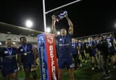 Wigan Warriors' Kai Pearce-Paul celebrates after the Leigh game with the League Leaders Shield