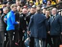 Chris Wilder and Shaun Maloney have a slight difference of opinion at Watford on Saturday