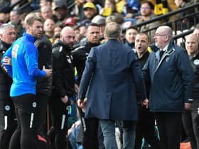 Chris Wilder and Shaun Maloney have a slight difference of opinion at Watford on Saturday