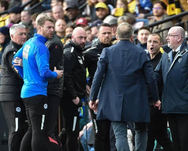 Chris Wilder and Shaun Maloney have a slight difference of opinion at Watford on Saturday