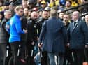 Chris Wilder and Shaun Maloney have a slight difference of opinion at Watford on Saturday