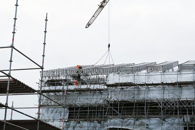 Scaffolding surrounding Haigh Hall is removed, part of the Haigh Hall project.