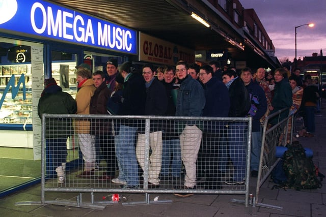 A queue of Verve fans outside Omega Music, Standishgate in 1998 waiting to snap up tickets for the band's famous gig at Haigh Hall