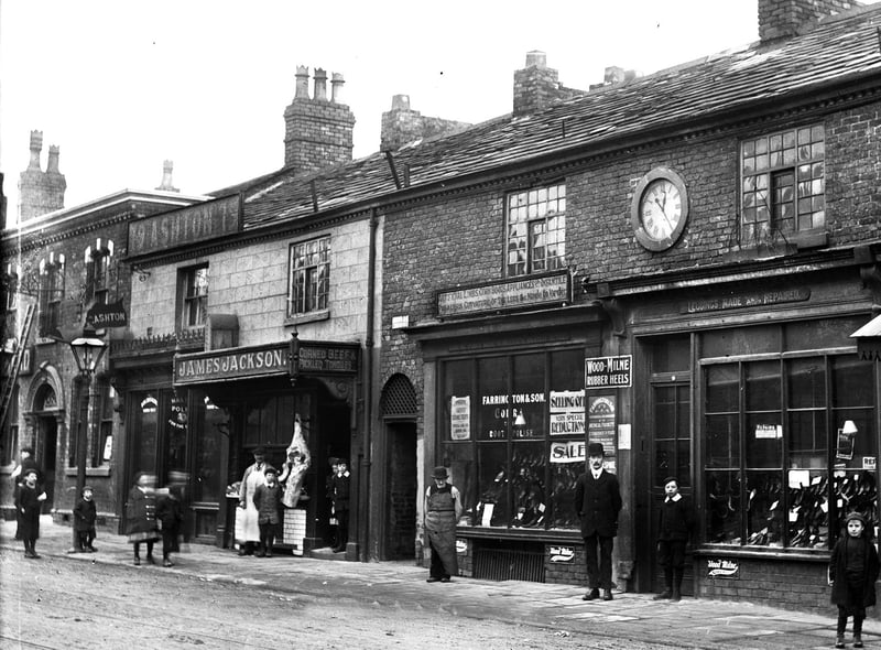 Farrington and Son on Wigan Lane advertising artificial limbs, cork boots, appliances for infantile paralysis and curvature of the legs. Made to order. Next door is James Jackson advertising corned beef and pickled tongues around the turn of the 20th century.