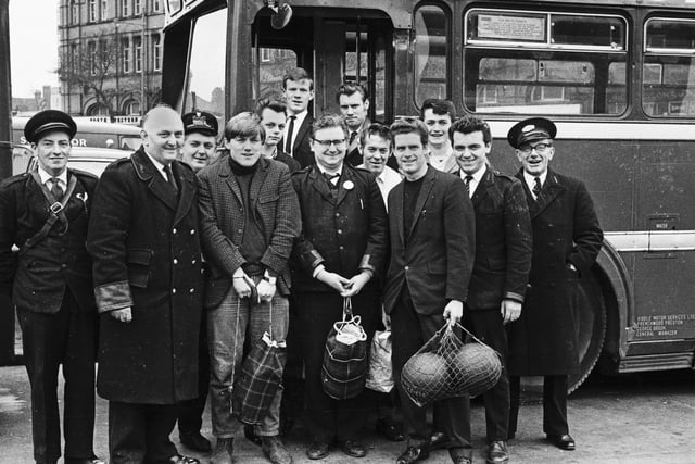 The Ribble buses inter departmental football team ready to board the bus on Wigan market square in 1965.