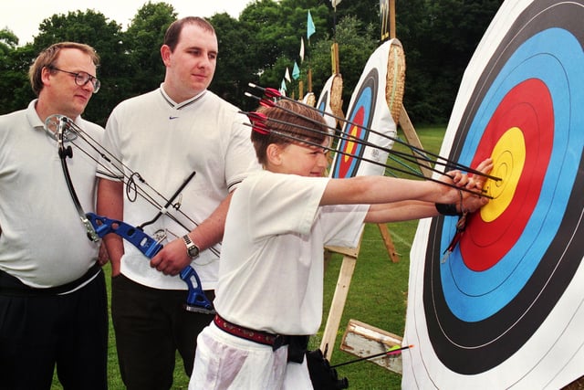 Orrell club members Al Daniel, Ian Lucas and Gary Daniel check the score during an archery competition at St. Joseph's College, Up Holland, on Saturday 19th of June 1999.
The tournament was organised by the Lancashire Archery Association and competitors came from all over the North of England.