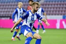 Callum McManaman led Latics out for the first time in a competitive fixture against Morecambe on Tuesday night