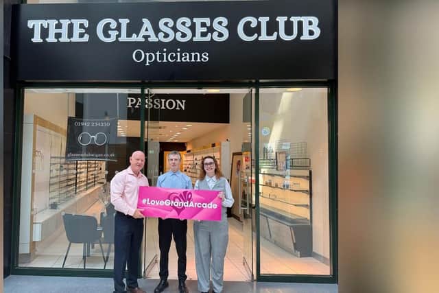 Opening day at The Glasses Club. Grand Arcade manager Mike Matthews (left) with optical assistants Beth Allibone and Garry Marshall