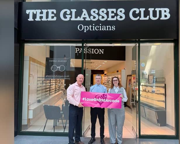 Opening day at The Glasses Club. Grand Arcade manager Mike Matthews (left) with optical assistants Beth Allibone and Garry Marshall