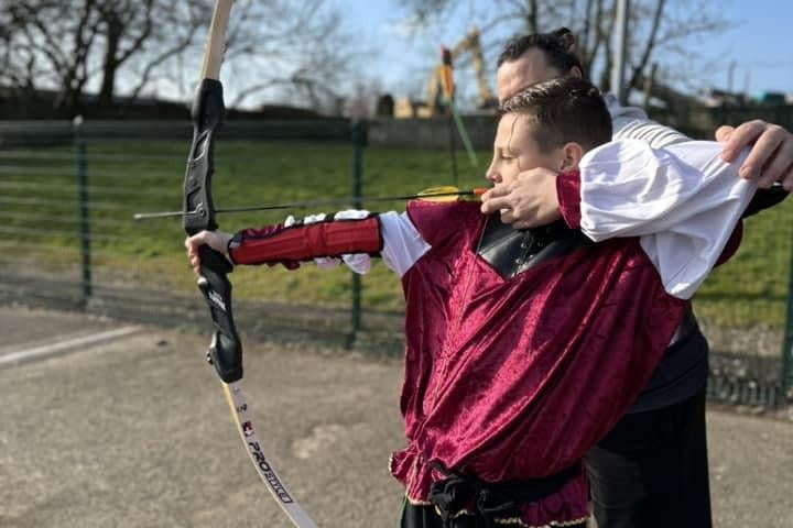 Pupils enjoying archery lessons