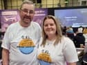 Peter Perks and Bekah Bamba wearing their promo Are We There Yet India, Rickshaw Challenge t-shirts.