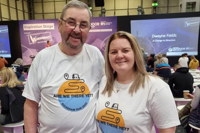 Peter Perks and Bekah Bamba wearing their promo Are We There Yet India, Rickshaw Challenge t-shirts.