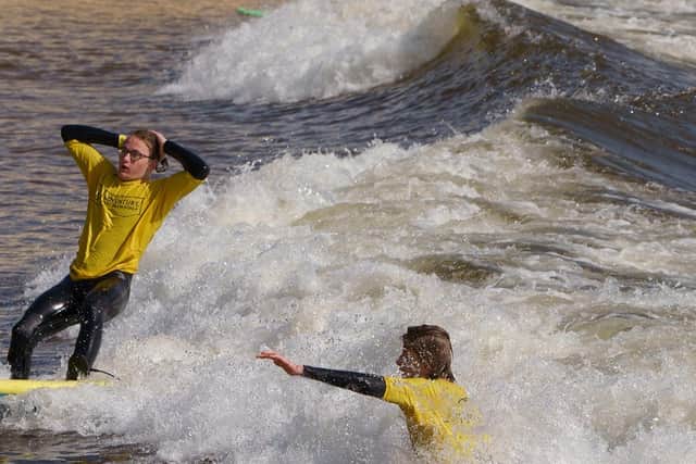 WYZ members having a go at surfing