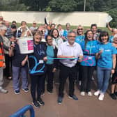 Coun Chris Ready (centre) and Pauline Blackie of Alzheimer's Society (holding bucket, front left) with fundraisers at last year's Pennington Hall Park Memory Walk