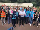 Coun Chris Ready (centre) and Pauline Blackie of Alzheimer's Society (holding bucket, front left) with fundraisers at last year's Pennington Hall Park Memory Walk