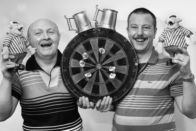 Celebrating their big win on television's Bullseye show in December 1990 are Wigan's Griffin pub darts stars Derek Wilding, left, and Mark Vidler.
They actually won the star prize of a speedboat but decided to accept the cash equivalent as well as prizes including a dishwasher, cordless telephone, personal stereo, video recorder, food processor, an electrical knife and £362 cash.  Welsh professional darts star Brian Cairns won £600 in the charity throw which the lads split between Wigan Hospice and Chorley Children's Hospice Appeal.
