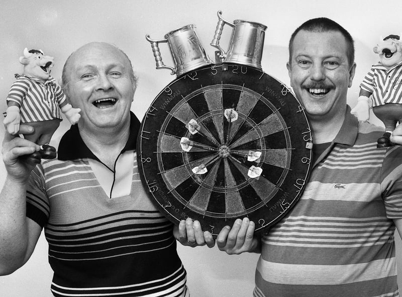 Celebrating their big win on television's Bullseye show in December 1990 are Wigan's Griffin pub darts stars Derek Wilding, left, and Mark Vidler.
They actually won the star prize of a speedboat but decided to accept the cash equivalent as well as prizes including a dishwasher, cordless telephone, personal stereo, video recorder, food processor, an electrical knife and £362 cash.  Welsh professional darts star Brian Cairns won £600 in the charity throw which the lads split between Wigan Hospice and Chorley Children's Hospice Appeal.