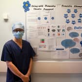 Kellie Baldwin, left and Mark Oakley by the Dementia Passport board in Theatres