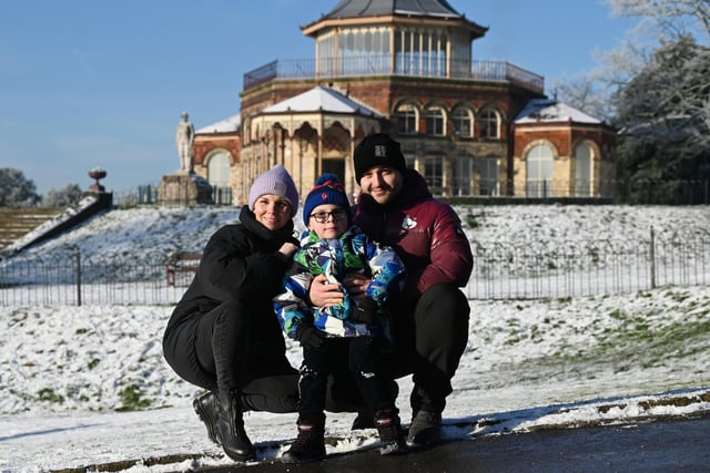 Wigan snow scenes - People make the most of the winter weather as snow falls on Mesnes Park, Wigan.