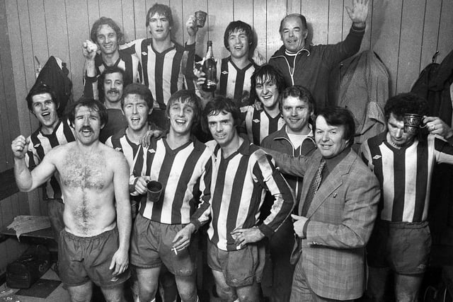 Wigan Athletic players with manager Ian McNeill and trainer Kenny Banks celebrate their 1-0 win over Division 4 York City in the FA Cup 1st round match at Springfield Park on Saturday 26th of November 1977.  John Wilkie was the goalscorer.