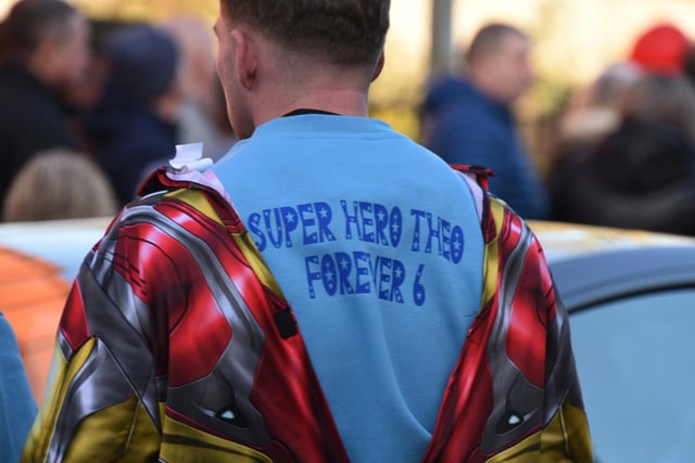 Some mourners wore superhero costumes or T-shirts featuring messages for Theo