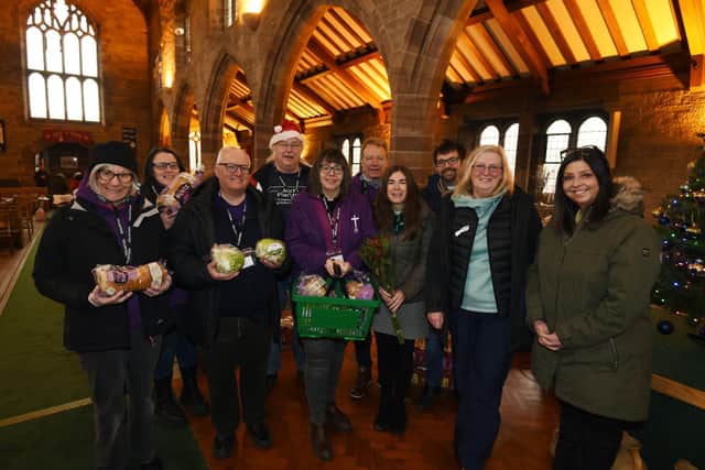 Volunteers at the Heat Hub and Jed's Pantry, Members of the public are given a warm welcome with hot drinks and food at the pay-as-you-feel cafe run by volunteers, weekly Heat Hub, every Tuesday at St Stephen's Church Hall, Whelley, Wigan, also Jed's Pantry is operating in the Church.