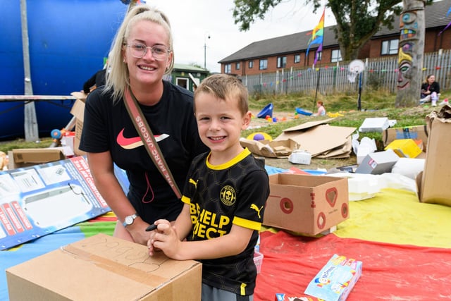 Leah Parkinson and Robbie Arkwright (5) playing with boxes at the Norley Hall fun day. Photo: Kelvin Stuttard
