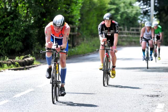 Ironman competitors heading through Standish in 2017