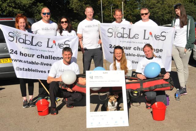 Carrie Byrom with volunteers and supporters of Stable Lives CIC before a fund-raising event