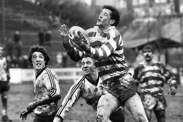 Wigan full-back Barry Williams leaps above challengers in a league match against Widnes at Central Park on Sunday 27th of February 1983.
The match was a 6-6 draw.