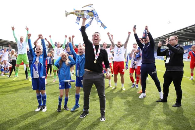 Leam Richardson lifts the League One title at Shrewsbury