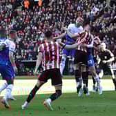 Jack Whatmough heads for goal at Sheffield United