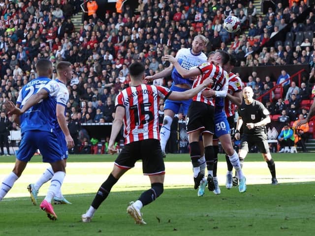 Jack Whatmough heads for goal at Sheffield United