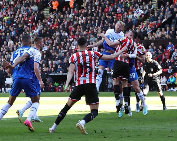 Jack Whatmough heads for goal at Sheffield United