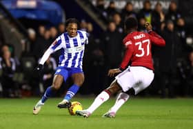 Martial Godo in action for Latics against Manchester United in last season's FA Cup third round