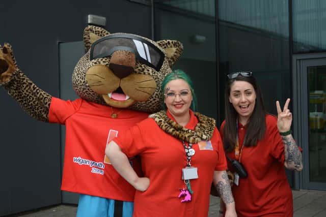 Youth workers with Wigan Youth Zone's mascot Jaguar Jeff