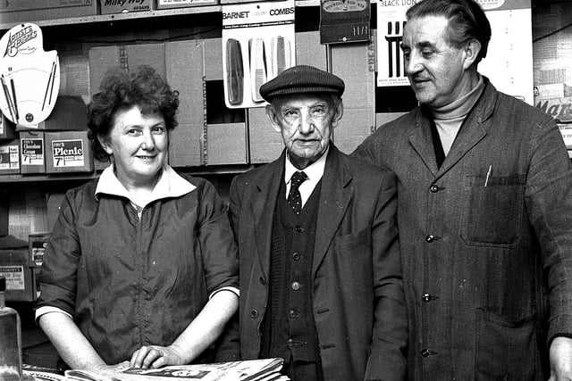 RETRO 1969 Wigan's oldest 'paper boy' 90 years-old Tom Robey, centre, delivers the Observer in 1969.