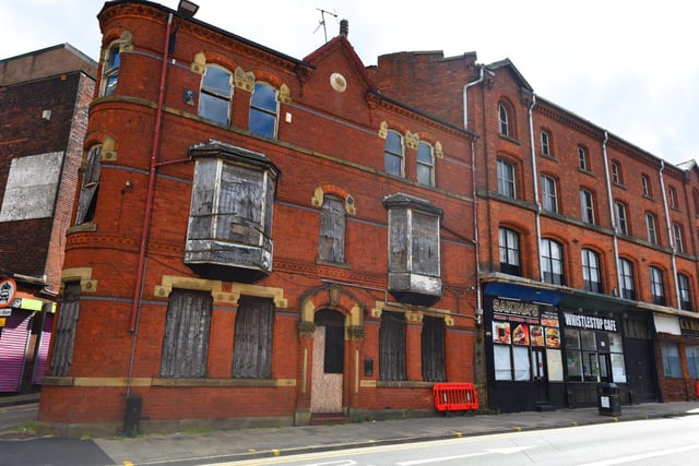 A disused, boarded up building on King Street West, Wigan, across from Wallgate railway station,  in desperate need of TLC