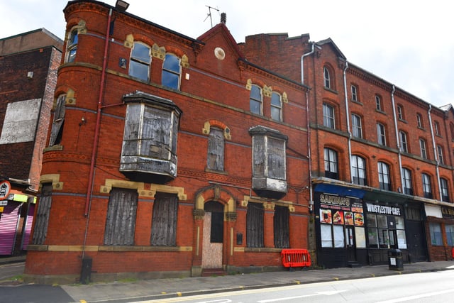 A disused, boarded up building on King Street West, Wigan, across from Wallgate railway station, in desperate need of TLC