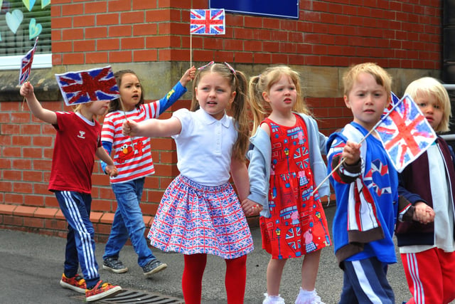 Staff and pupils at Mab's Cross primary school, Wigan, parade around the school, part of celebrations for the Queen's platinum jubilee.