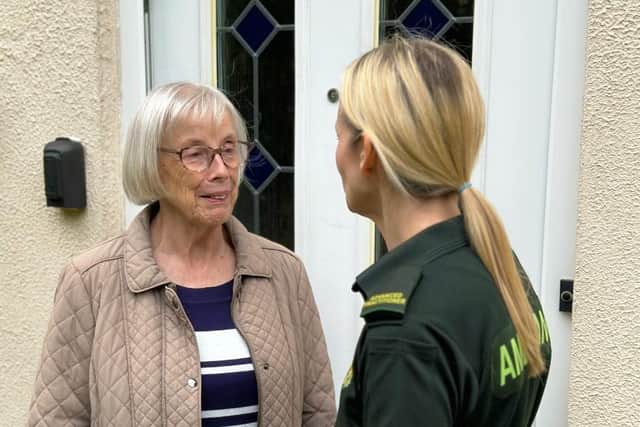 Community Specialist Paramedic Sara Harris with member of the public
