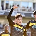 Luke Chambers (left) celebrates scoring at Bristol Rovers with James Carragher