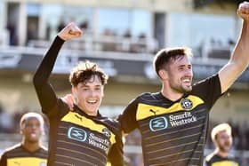 Luke Chambers (left) celebrates scoring at Bristol Rovers with James Carragher