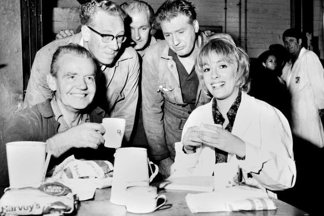 Esther Rantzen, best known as presenter of television's "Thats Life", enjoys a cuppa with workers during a visit to the Croda glue works factory at Appley Bridge in 1971 as part of tv programme "Braden's Week".