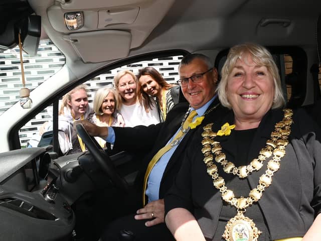 Mayor of Wigan Coun Marie Morgan in the new van with consort Coun Clive Morgan and the team at Daffodils Dreams